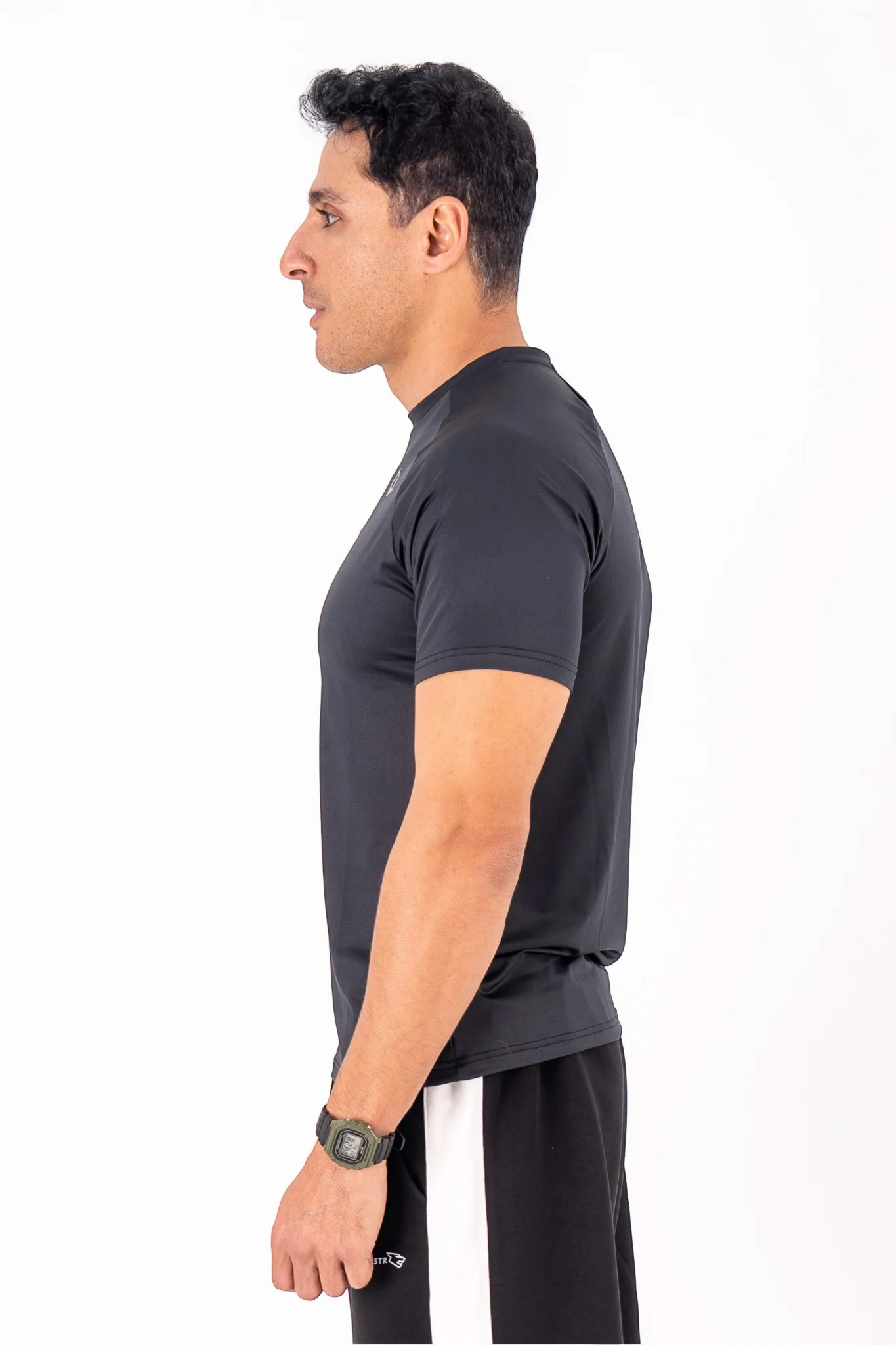 BEASTR black polyester performance tee with athletic fit and raglan sleeves for men.