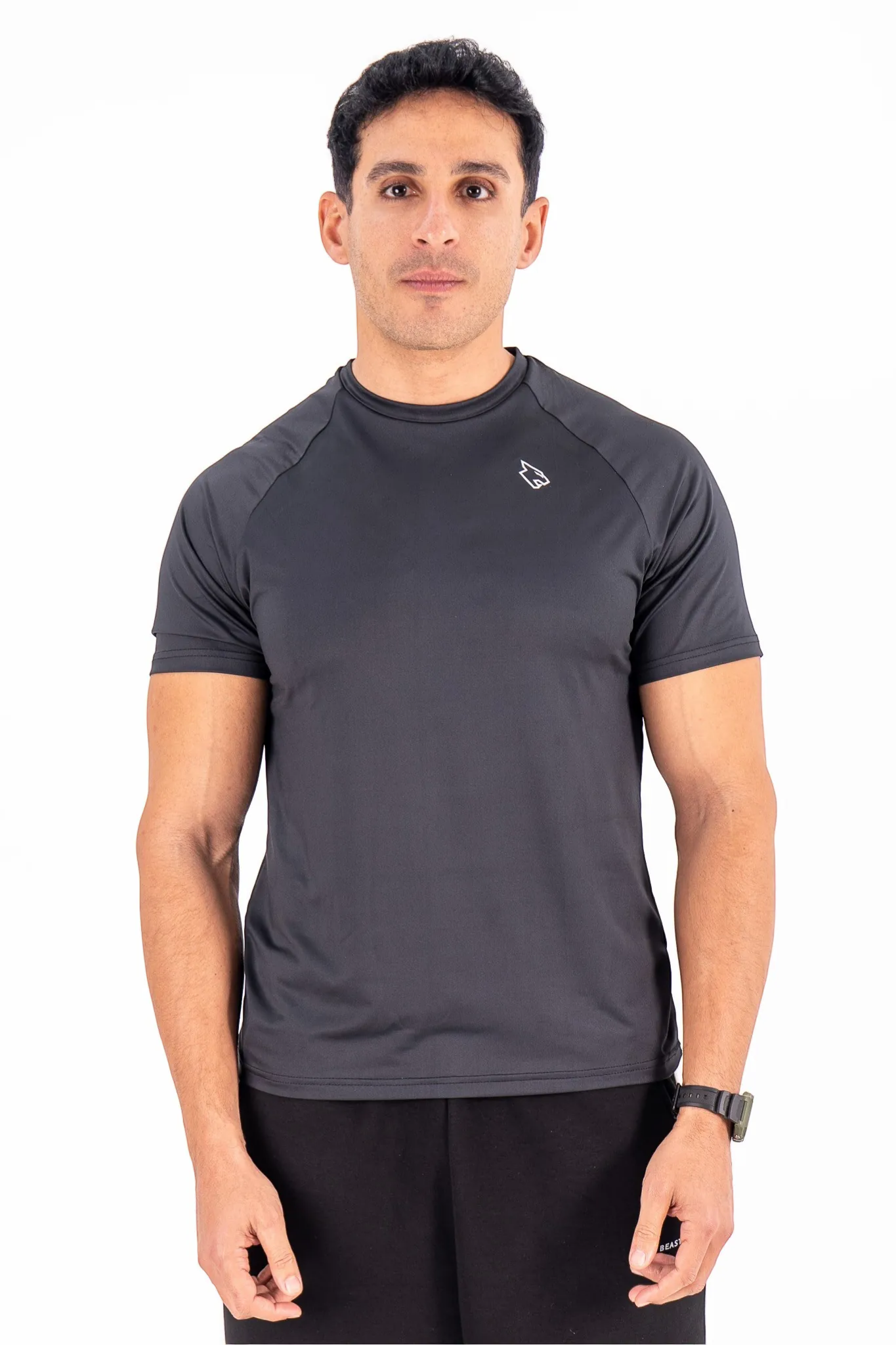 BEASTR men's black polyester performance tee with raglan sleeves and a tapered athletic fit.