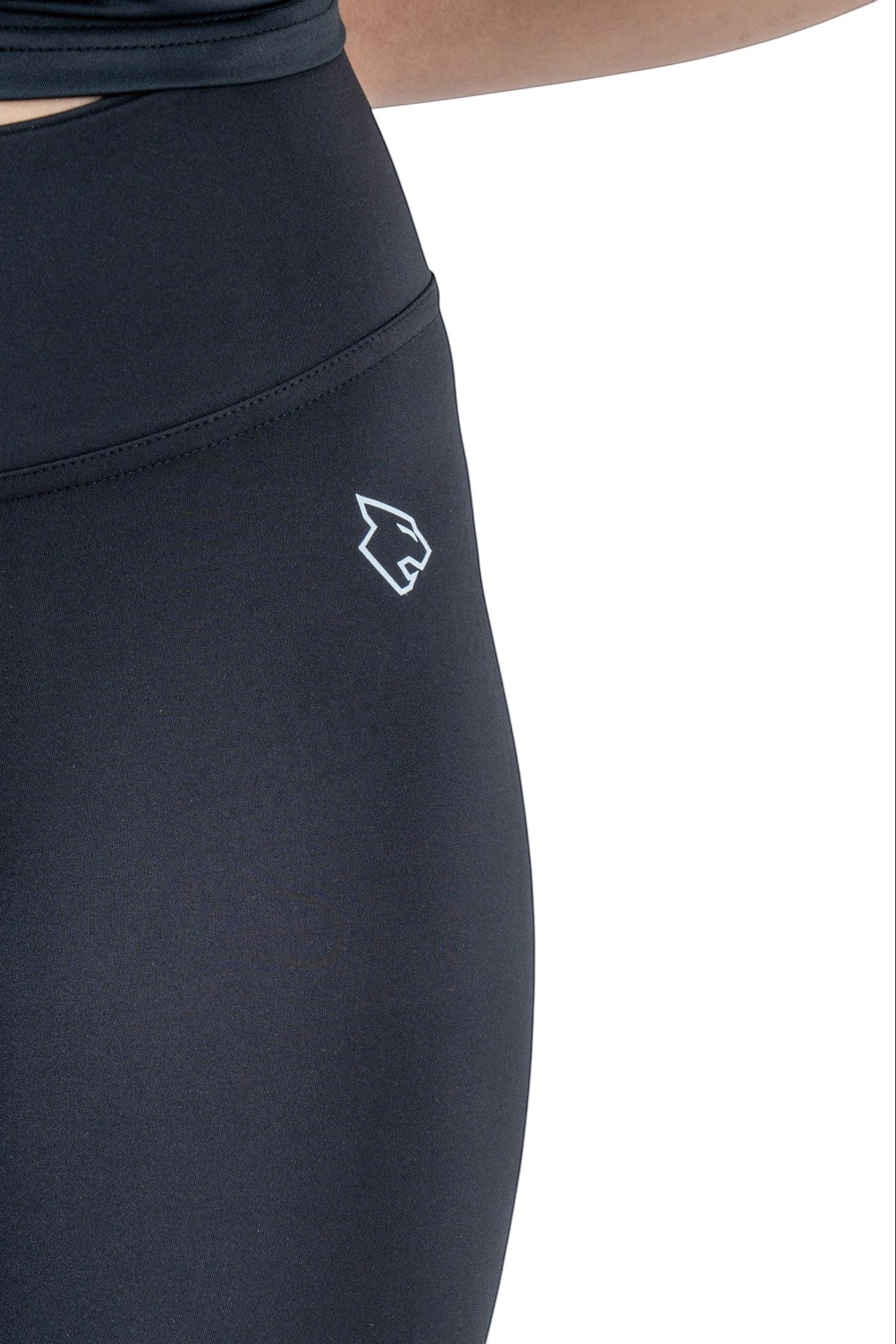 BEASTR black high-waisted polyester-spandex performance leggings with white logo detail.